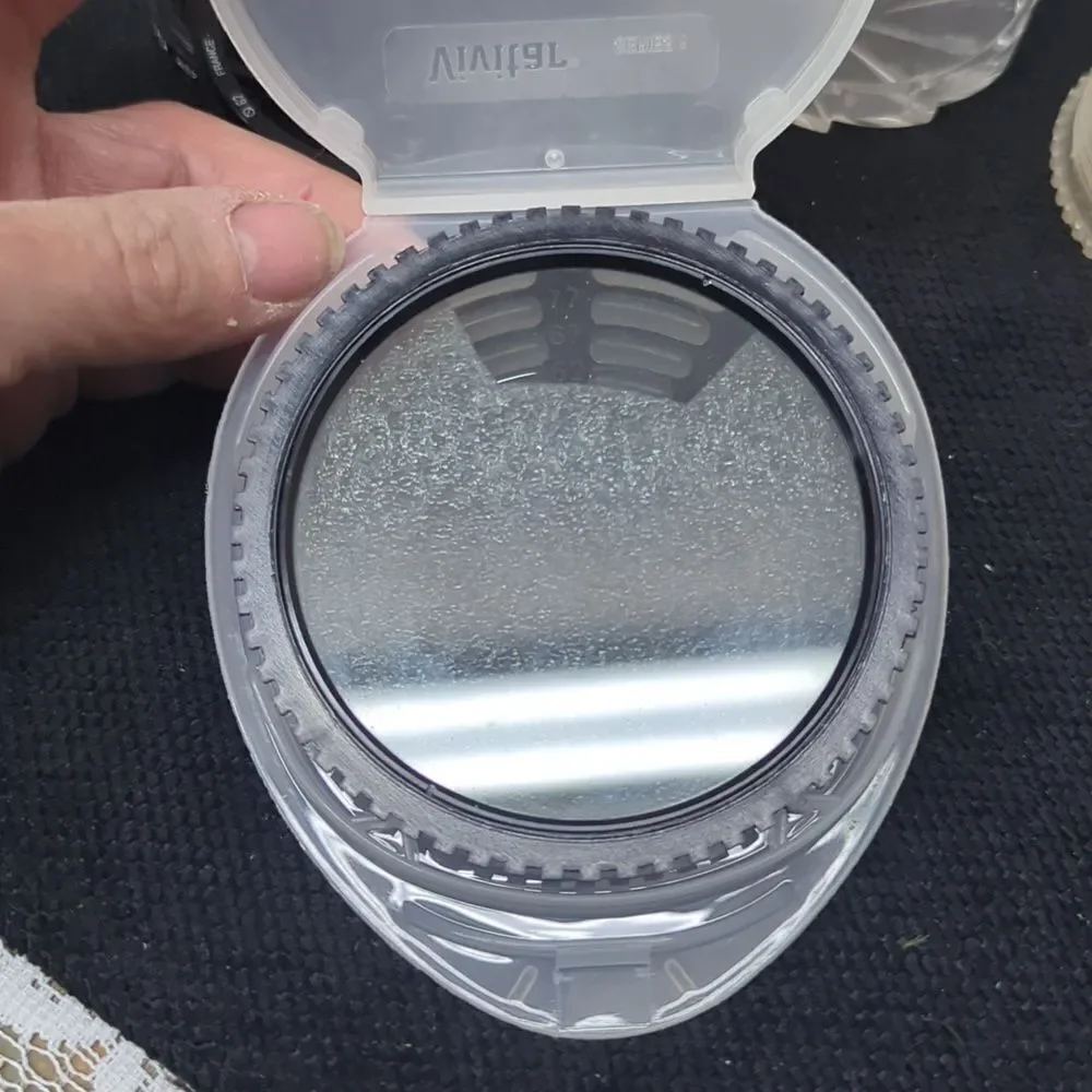 collection‎ of camera lens filters, likely used for photography